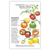 Seed packet for Rainbow Blend Pole Cherry Tomato featuring an illustration of vine-ripened tomatoes in red, orange, yellow, green, and striped varieties, plus one sliced open, with text noting frost sensitivity, 55–90 days from transplanting, and seven varieties in one packet.