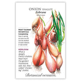 Seed packet for Zebrune Shallot Onion featuring an illustration of elongated, coppery-pink bulbs with green shoots and roots, alongside text noting it's frost tolerant, heirloom, 100 days from transplanting, and nicknamed the 