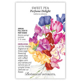 Seed packet for Perfume Delight heirloom sweet pea featuring a watercolor illustration of ruffled blooms in purple, pink, red, yellow, and white, with text noting it's an annual for full sun to part shade, blooming spring/summer on 5'-6' vines.