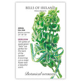 Botanical Interests seed packet for Bells of Ireland (Moluccella laevis) featuring an illustration of tall spikes with layered apple-green bell-shaped calyxes tied with a checkered ribbon, alongside text noting it's a heirloom annual for full sun, 24