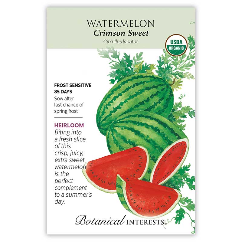 Seed packet for Crimson Sweet Watermelon, USDA Organic and Heirloom, illustrated with striped whole melons and cut red wedges, with text noting frost sensitivity, an 85-day maturity, and a description of the crisp, juicy fruit.