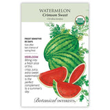 Seed packet for Crimson Sweet Watermelon, USDA Organic and Heirloom, illustrated with striped whole melons and cut red wedges, with text noting frost sensitivity, an 85-day maturity, and a description of the crisp, juicy fruit.