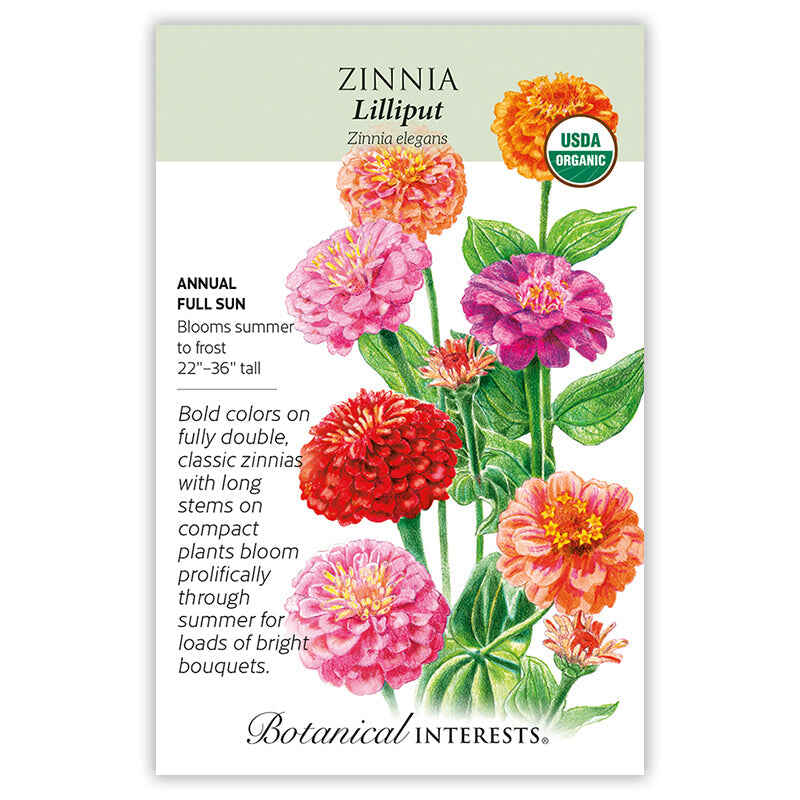 Seed packet for Lilliput Zinnia illustrated with fully double pom-pom blooms in orange, red, pink, and magenta on long stems, with printed text noting USDA Organic certification, full sun, 22–36 inches tall, and summer-to-frost blooming.