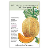 Seed packet for Botanical Interests' organic heirloom 'Hale's Best Jumbo' cantaloupe, illustrated with a netted orange melon, a cut wedge showing bright orange flesh, a vine leaf and yellow blossom, plus text noting frost sensitivity, an 85-day maturity, and USDA Organic certification.