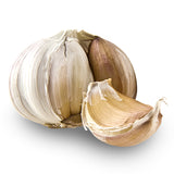 Whole elephant garlic bulb with papery white and purple-tinged skin, alongside one large clove separated to show its plump, smooth interior.