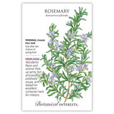 Seed packet for heirloom Rosemary featuring a detailed illustration of woody, needle-leaved stems with small lavender-blue flowers, alongside text noting it's a tender perennial for full sun, sown after last frost, praised for flavoring lamb, fish, poultry and bread.