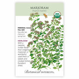 Seed packet for organic heirloom Marjoram featuring a botanical illustration of small pink-flowered clusters and oval green leaves with a bee, alongside text noting it's a tender perennial for full sun, sown after last frost, with a sweeter flavor than oregano.