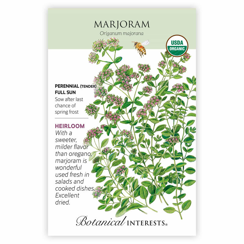 Seed packet for organic heirloom Marjoram featuring a botanical illustration of small pink-flowered clusters and oval green leaves with a bee, alongside text noting it's a tender perennial for full sun, sown after last frost, with a sweeter flavor than oregano.