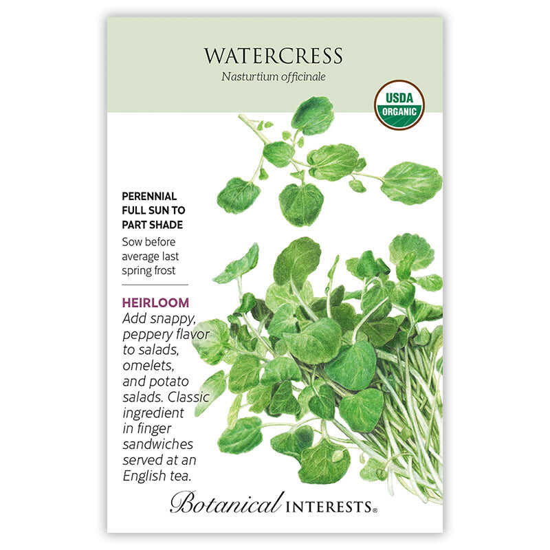 Seed packet for organic Heirloom Watercress featuring a botanical illustration of round, scalloped green leaves on trailing white stems, with text noting it's a perennial for full sun to part shade, sown before last spring frost, prized for its peppery flavor in salads and sandwiches.