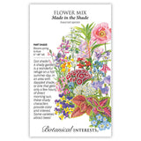 Front of a Botanical Interests seed packet for Made in the Shade Flower Mix Seeds featuring plant details and a detailed botanical illustration of shade-loving flowers and foliage in various colors.