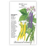 Seed packet for Bush Trio bean illustrating yellow, purple, and green pods with pale purple flowers on leafy vines, alongside text noting it's frost sensitive, matures in 45-55 days, and describes the mix as flavorful, productive, and good for canning or freezing.