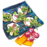 Illustration of crackers topped with soft cheese and colourful microgreens, showing slender red and green stems and small leaves, arranged on a dark blue textured plate beside red grapes and slices of cheese.