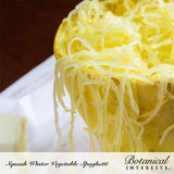 Close-up view of cooked, shredded spaghetti squash strands served inside the squash skin, labeled 