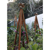 Oxide pyramid-shaped metal Akoris Garden Obelisk Large trellises with bronze sphere finials set among lush green foliage and purple flowering plants
