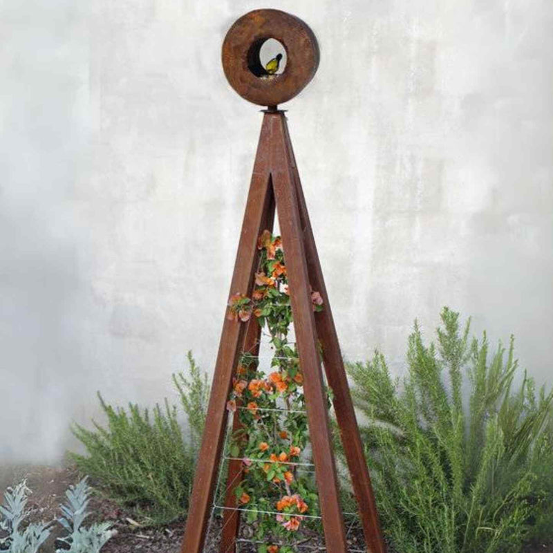 Zinc metal A-frame Bird Cafe with Trellis topped with a circular oxide steel bird feeder, featuring orange flowers climbing the trellis