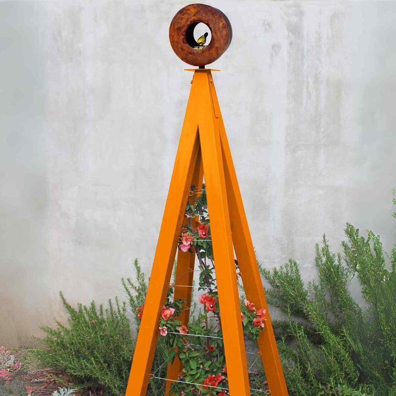 Orange metal A-frame Bird Cafe with Trellis topped with a circular oxide steel bird feeder, featuring orange flowers climbing the trellis
