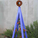 Aubergine metal A-frame Bird Cafe with Trellis topped with a circular oxide steel bird feeder, featuring orange flowers climbing the trellis