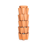 Terracotta-coloured GreenStalk 5-tier vertical planter, a tall stacked tower with staggered outward-facing pockets around each level for planting, shown empty against a plain white background.