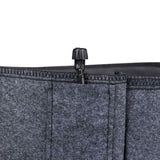 Close-up of a grey felt grow bag's stitched rim, showing a small black plastic irrigation valve fitted into the top seam for connecting a drip watering line.