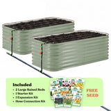 Two mist green corrugated raised garden beds with soil inside, connected by a black hose of the epic irrigation system on a white background. A light green banner at the bottom lists included items: 2 29-inch tall large raised beds, 1 starter kit, 1 expansion kit, and hose connection kit, with a small seed packet collage and the words 'FREE SEED'.