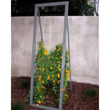 Gray metal frame A-frame Mira Garden Trellis with black-eyed Susan vines climbing up the grid wire, positioned in front of a concrete wall