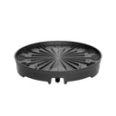 Round black plastic spinning base for a vertical planter, featuring radiating ribbed channels, a raised rim, and a small drainage outlet spout on one side, shown on a plain white background.