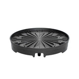 Round black plastic spinning base for a vertical planter, featuring radiating ribbed channels, a raised rim, and a small drainage outlet spout on one side, shown on a plain white background.