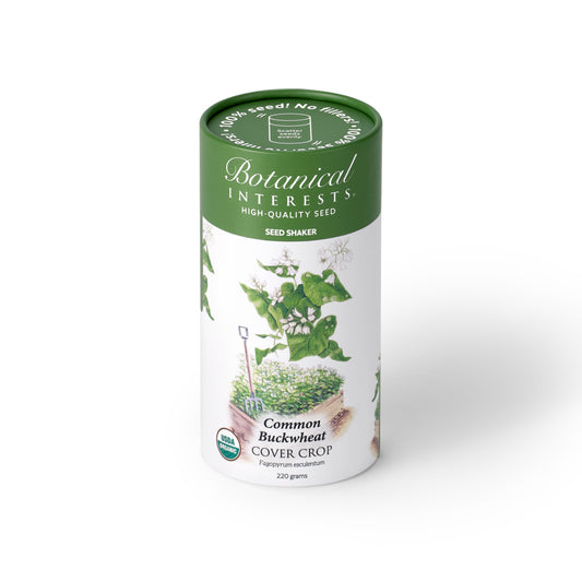 Botanical Interests Common Buckwheat Cover Crop 220-gram seed shaker tube on a plain white background, featuring a green lid and illustration of white buckwheat flowers.