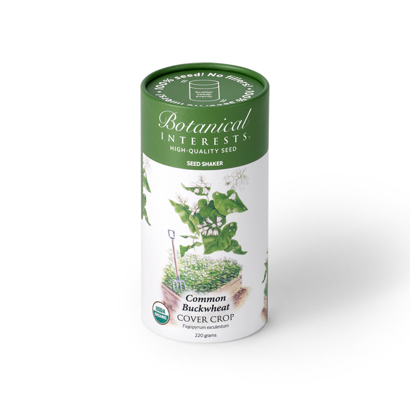 Botanical Interests Common Buckwheat Cover Crop 220-gram seed shaker tube on a plain white background, featuring a green lid and illustration of white buckwheat flowers.
