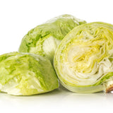 Two whole heads of pale green Great Lakes crisphead lettuce beside a halved head showing its tightly layered, crinkled white and green interior, on a white background.