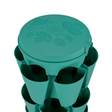 Teal GreenStalk vertical planter water reservoir lid on a white background.