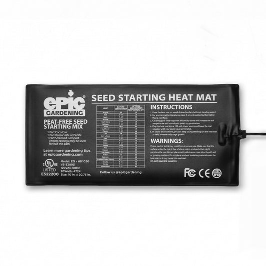 Black rectangular Epic Gardening seed starting heat mat with attached power cord, its surface printed with a peat-free seed starting mix recipe, a germination chart listing days-to-germination and optimal temperatures for various crops, numbered usage instructions, and safety warnings.