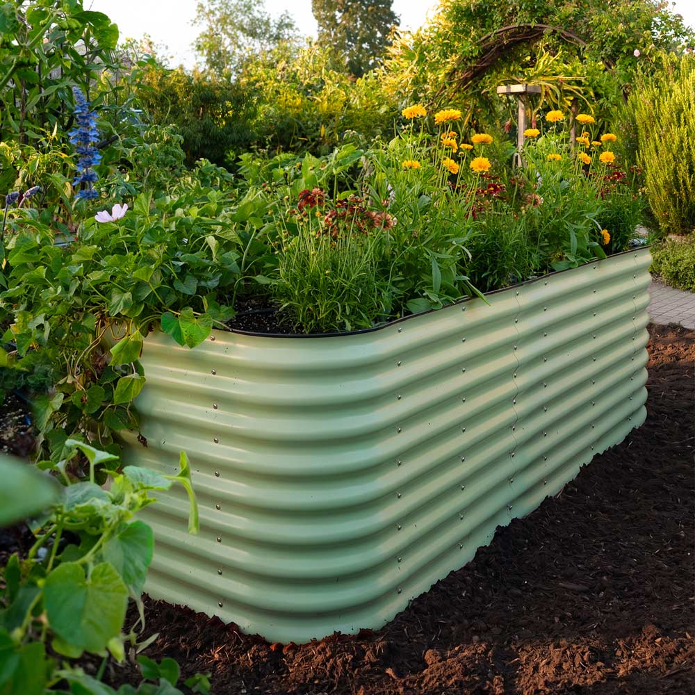 Epic Metal Raised Garden Bed growing in a lush garden
