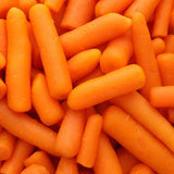 Close-up of peeled baby carrots piled together, their smooth orange skins and rounded, tapered tips filling the entire frame.