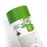 Close-up of the White Clover Alternative Lawn Seed Shaker container showing the QR for more information with a green cap and text on a white background