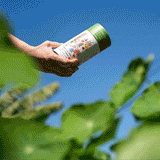 GIF of Southern Hills and Plains Flower Mix Seed Shaker being opened to spread the seeds on the ground. 