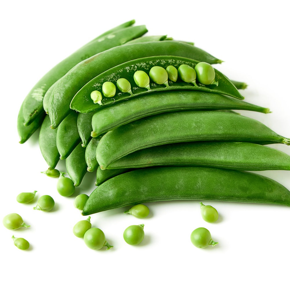 Close-up photo of fresh green Sugar Snap pea pods stacked together, with one opened pod revealing a row of bright green peas inside.