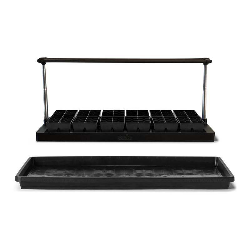 A group of 12 6-cell seed starting trays arranged below the standard epic gardening seed starting grow light. In front is the 1020 epic seed starting tray