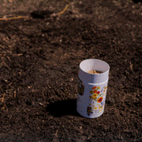 GIF of Water Wise Flower Mix Seed Shaker being spread on soil