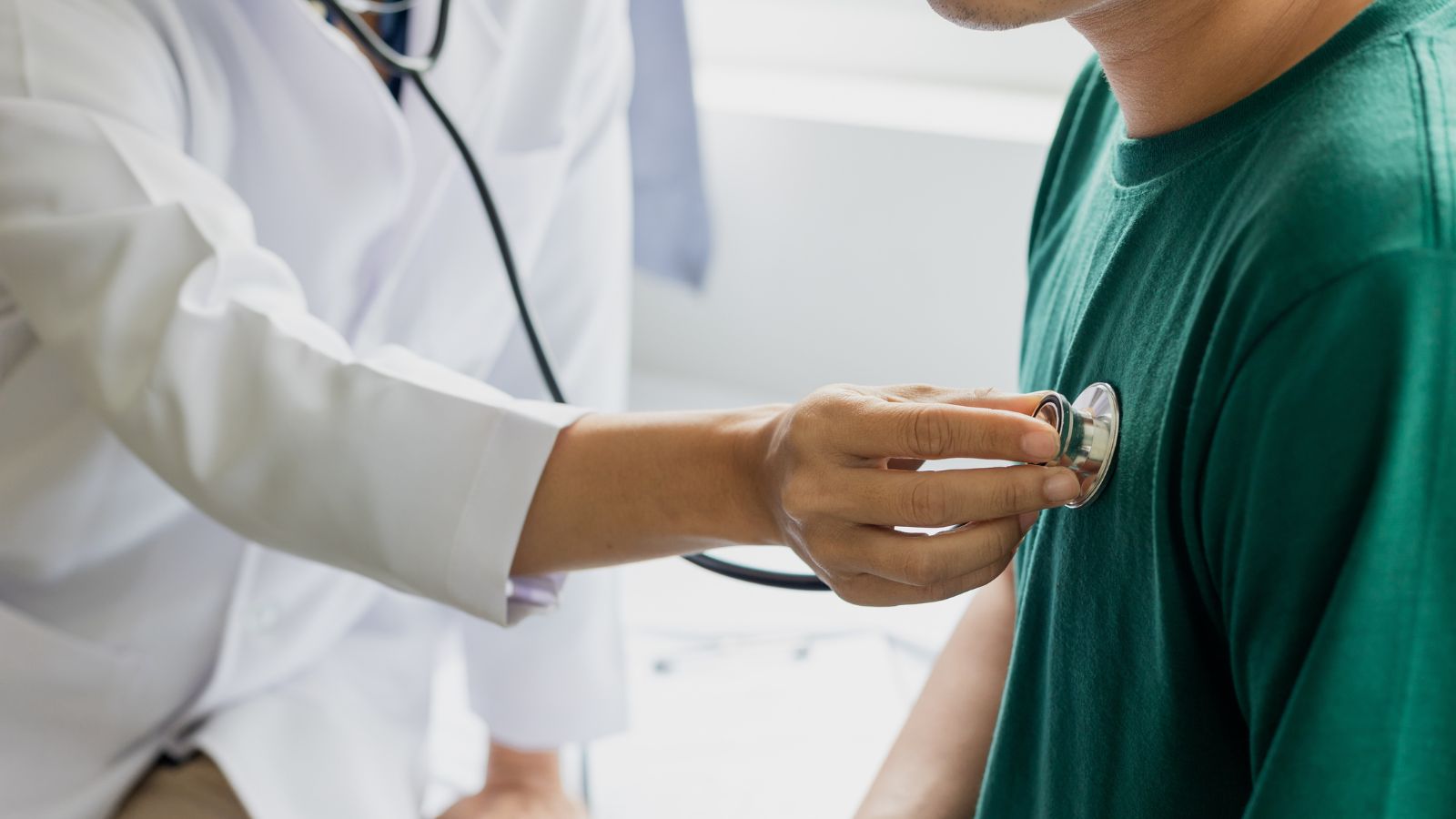 A shot of a doctor in the process of caring for a sick patient in a hospital setting