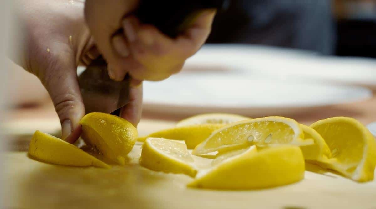 Person Chopping Lemons