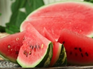 A close-up shot of a ripe and sliced crops with their germs exposed, showcasing how to grow store watermelon seeds