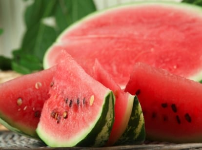 A close-up shot of a ripe and sliced crops with their germs exposed, showcasing how to grow store watermelon seeds